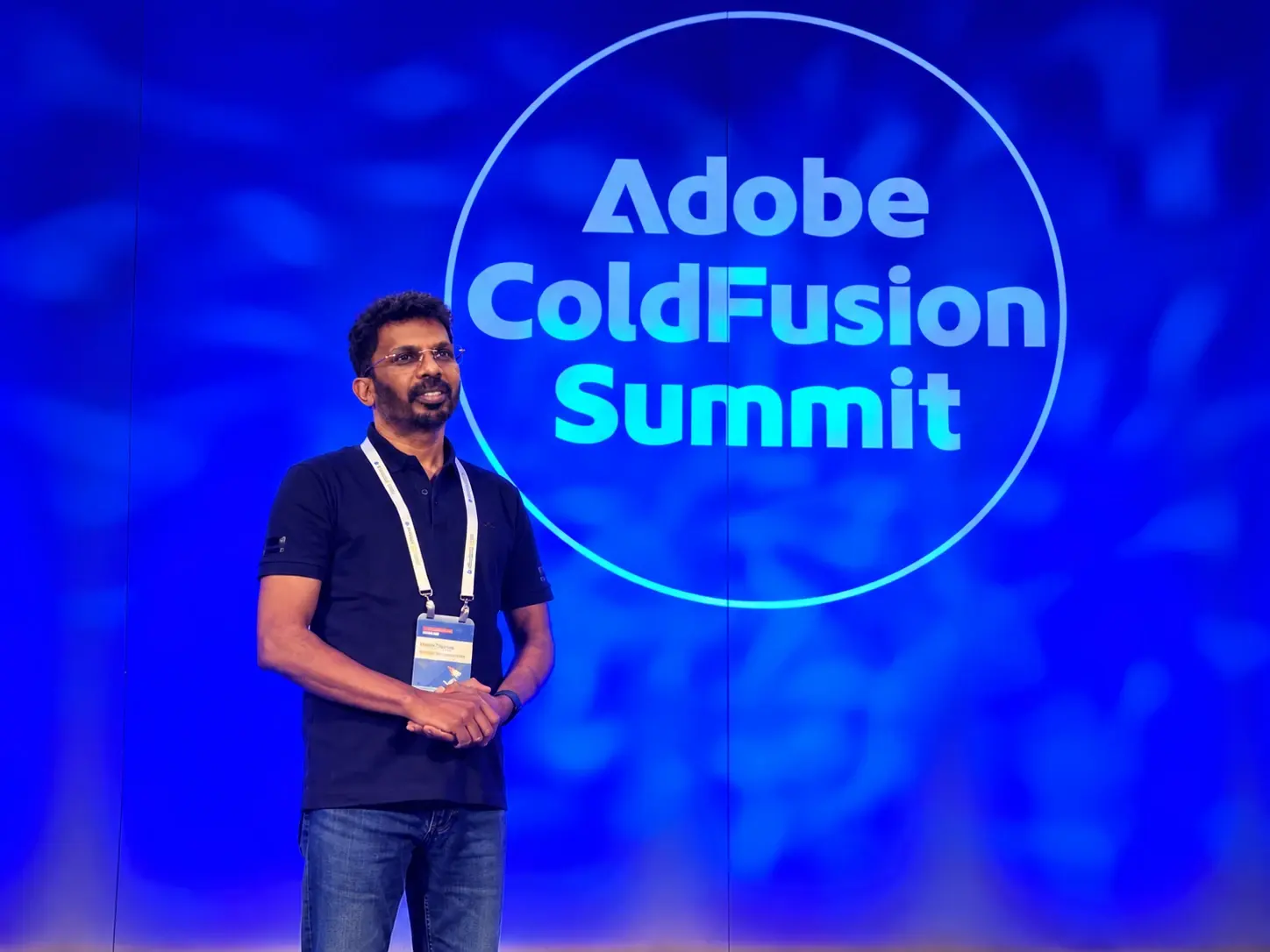 An Infoane engineer presenting on stage at the Adobe ColdFusion Summit